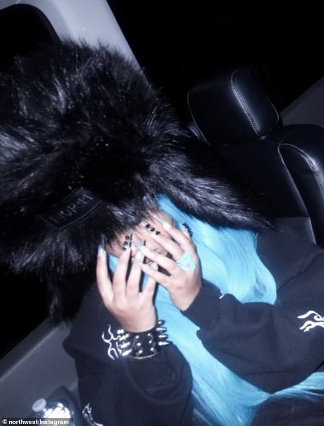 And in a few images, North placed her right hand near her face - where she had previously showed off the piercing back in the summer