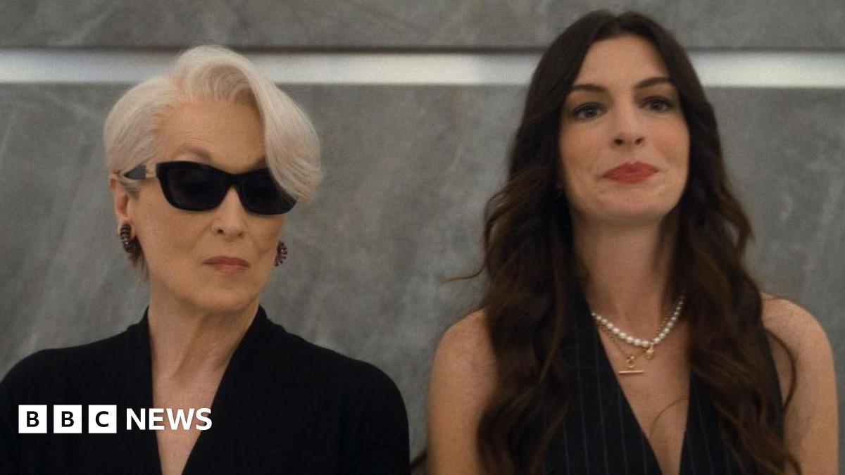 Meryl Streep and Anne Hathaway standing in a lift together in The Devil Wears Prada 2