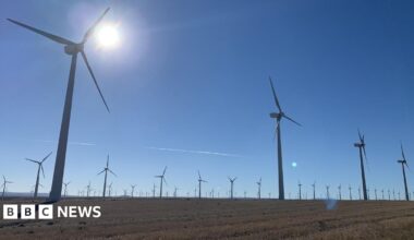 A giant wind turbine standing over the Spanish town of Figueruelas