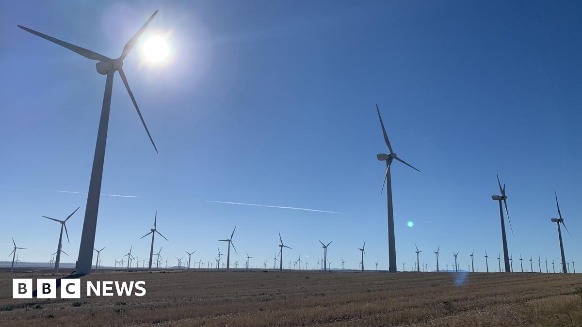 A giant wind turbine standing over the Spanish town of Figueruelas