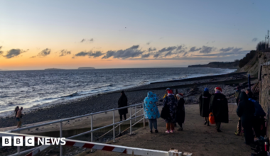 People gather to watch the Christmas Day sunrise in Penarth