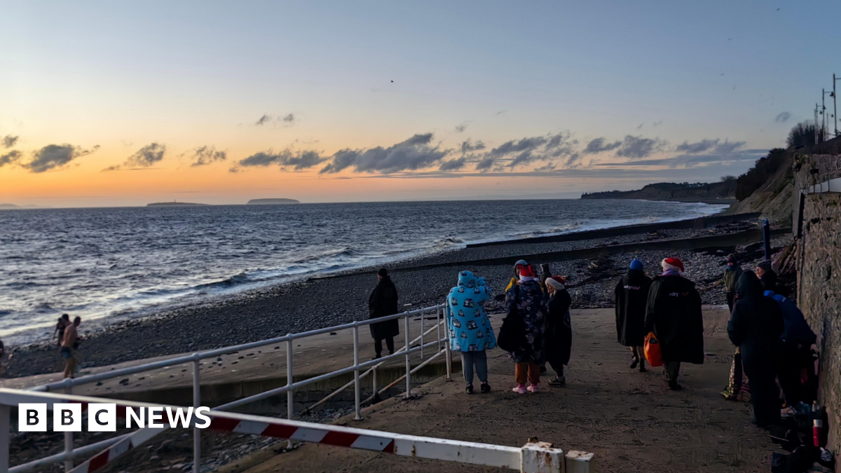 People gather to watch the Christmas Day sunrise in Penarth