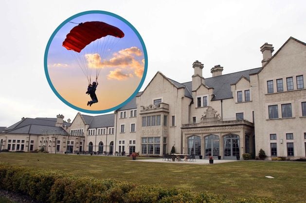 Lough Erne Hotel and Resort: Firefighters at the scene of ongoing rescue operation after paraglider crashes onto hotel roof