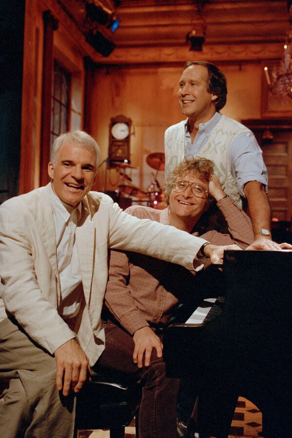 Steve Martin, Randy Newman and Chevy Chase rehearse a musical number at the NBC studios in New York's Rockefeller Center, Dec. 5, 1986, in preparation for their reunion on "Saturday Night Live." (AP Photo/Richard Drew, File)
