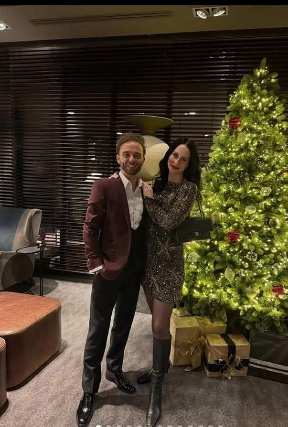Jack and Hanni Shepherd pictured in front of a Christmas tree 