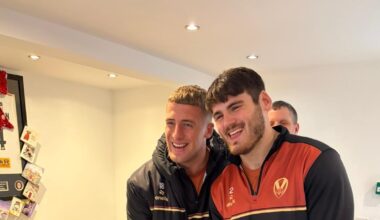 Saints players bring festive cheer to a group of supporters