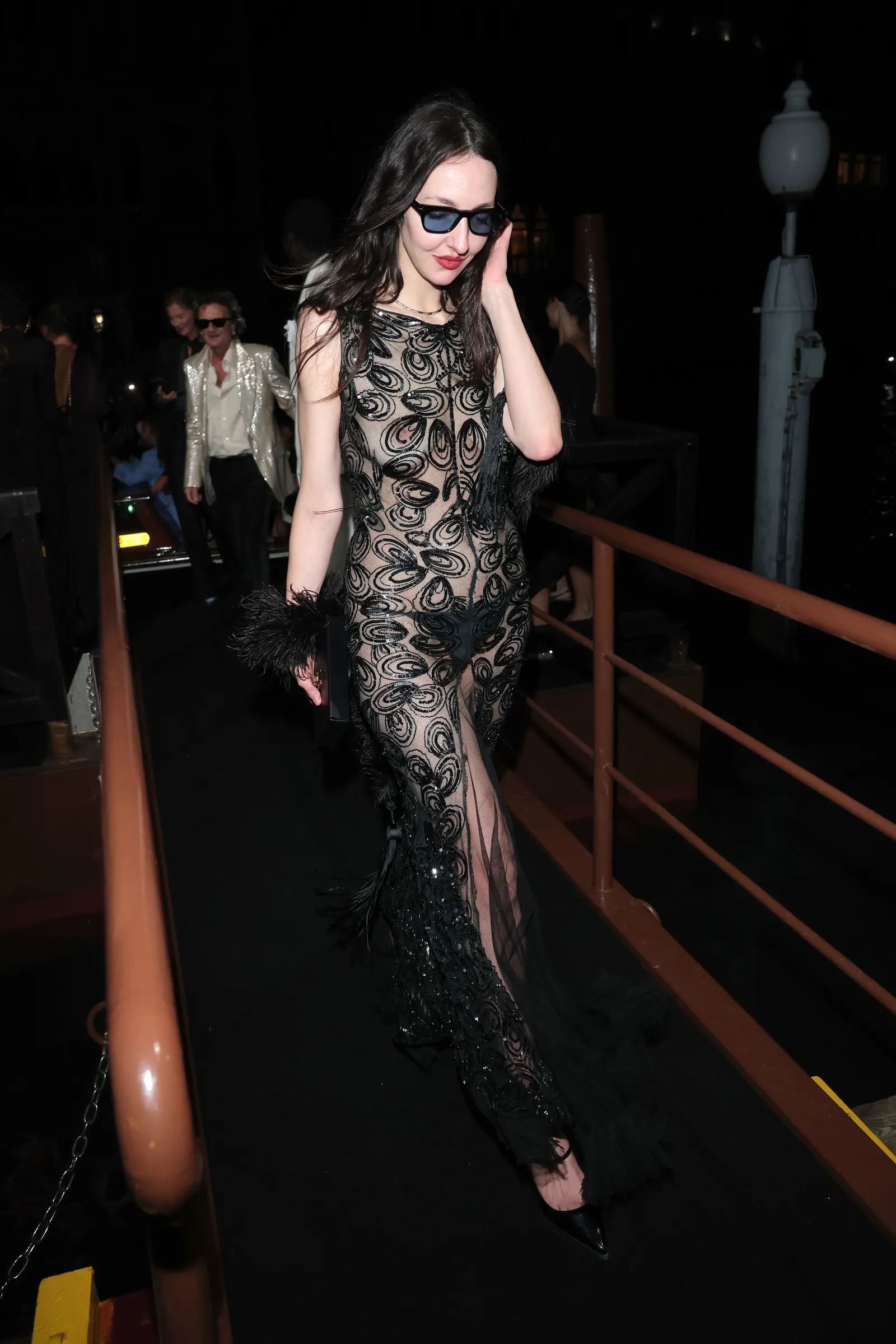 Image may contain Clothing Dress Urban Formal Wear Fashion Evening Dress Adult Person Face Head and Photography