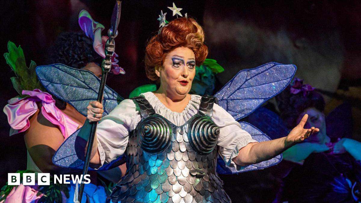 Catherine Wyn-Rogers as Queen of the Fairies performs on stage during a dress rehearsal of Iolanthe by Gilbert and and Sullivan. She is wearing an armour-style dress and a white blouse.