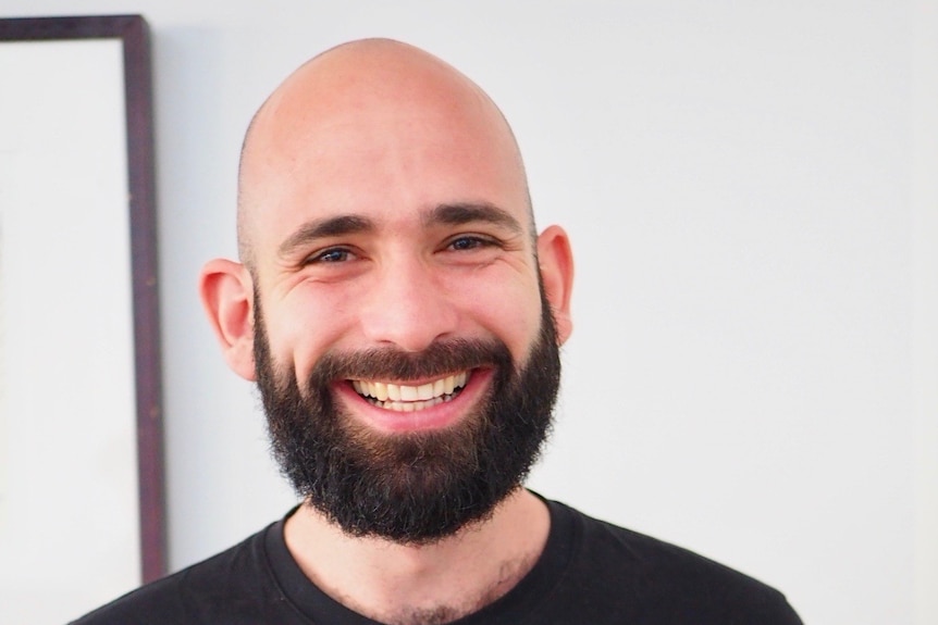 Dr Robbie Eres smiles.