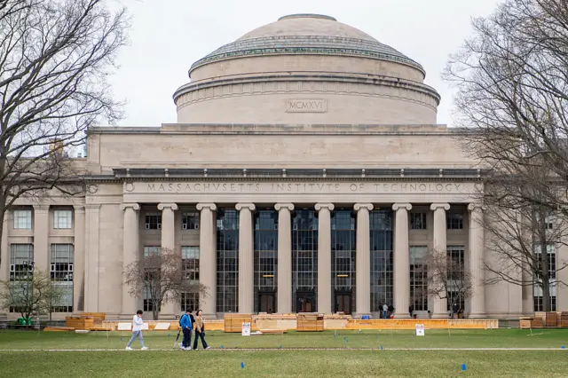 People walk on the campus of Massachusetts Institute of Technology (MIT) in Cambridge, Massachusetts