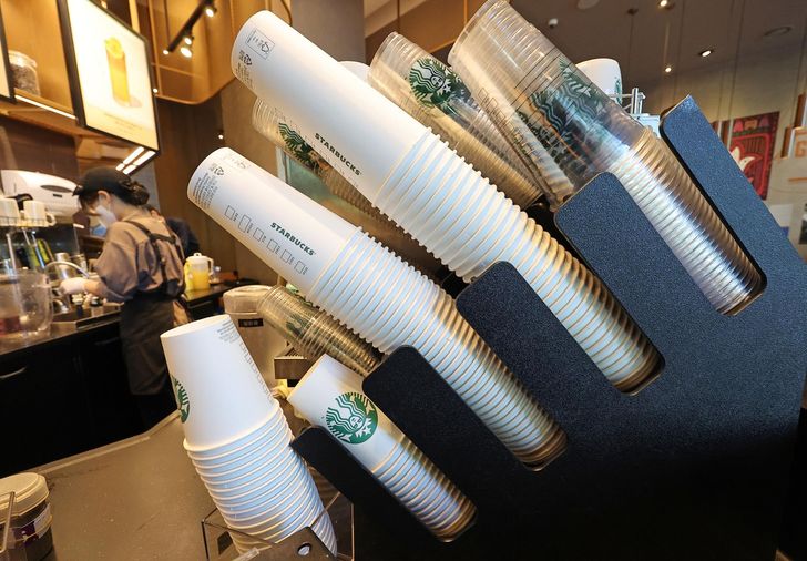 Stacks of disposable takeaway cups are seen at a franchise café in Seoul, Sept. 7, 2023. Yonhap