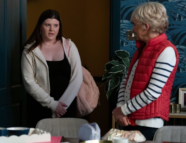 Lily stands in between Julie and Jean in EastEnders