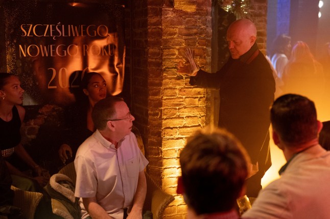 Max Branning talking to a group of people in Harry's Barn in EastEnders
