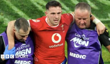 Owen Watkin is helped off against France in the 2025 Six Nations