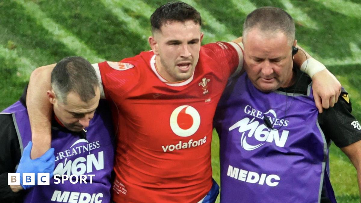 Owen Watkin is helped off against France in the 2025 Six Nations