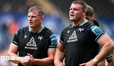 Jac Morgan applauds, Dewi Lake has hands on hips at the end of an Ospreys game