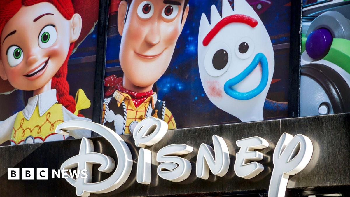 Toy Story characters seen above the Disney store entrance sign on Champs-Elysees avenue, Paris, France