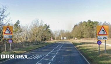 View of the A170 at the top of Sutton Bank, with max speed 20 warning signs