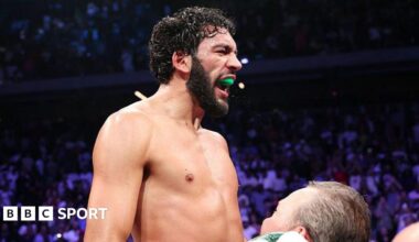 Hamzah Sheeraz celebrates as he is lifted up by his coach
