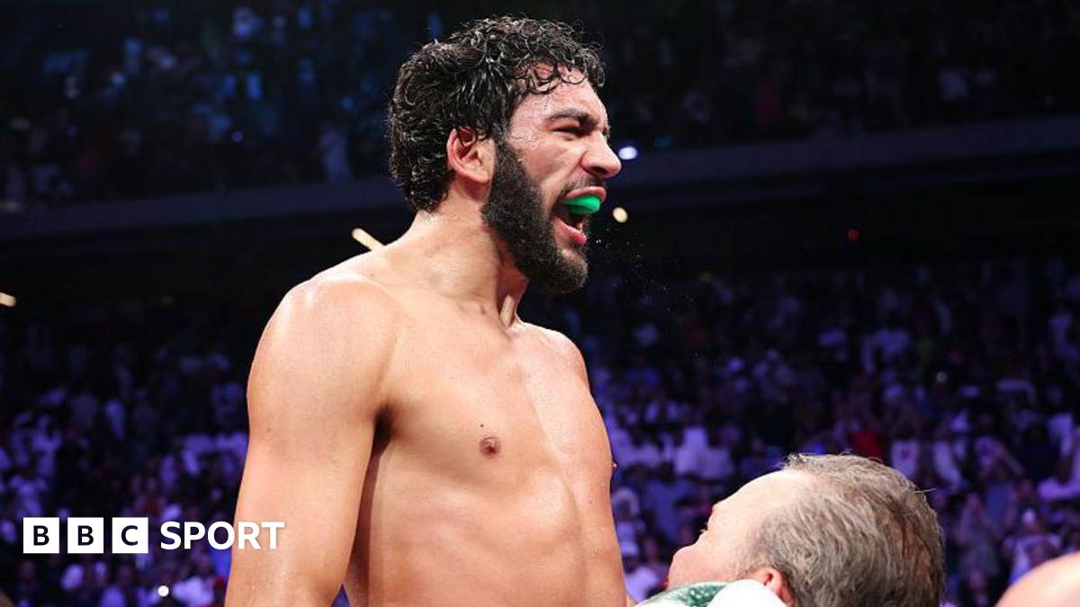 Hamzah Sheeraz celebrates as he is lifted up by his coach