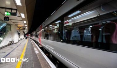 A train stands at a platform at Birmingham New Street.