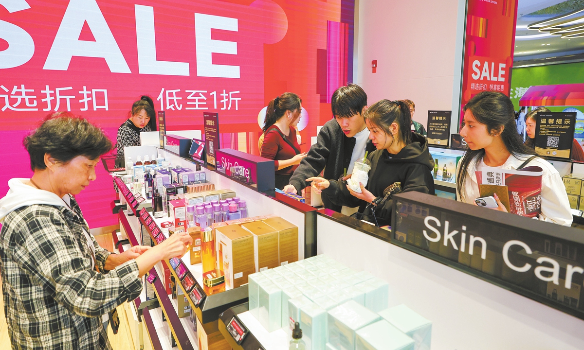 Customers shop at the Haikou International Duty Free City in Haikou, South China