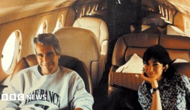 Jeffrey Epstein is smiling and seated in a plane with former girlfriend Ghislaine Maxwell