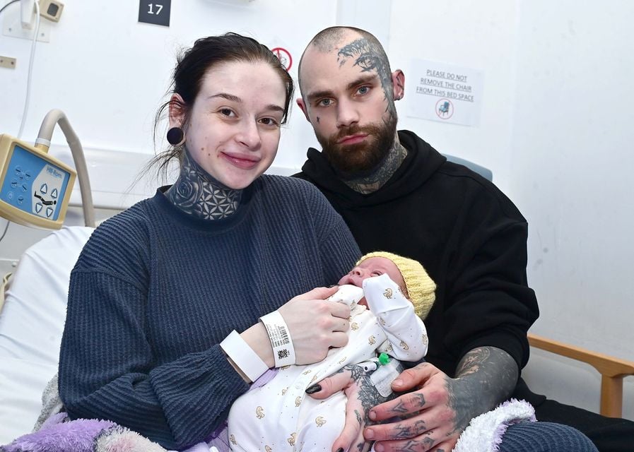 Chloe Coggles holding her new born son at the Royal Victoria Hospital in Belfast