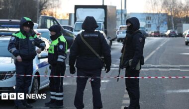Law enforcement officers block the road near the scene where two traffic police officers and another person were killed in a blast in Moscow, Russia December 24, 2025