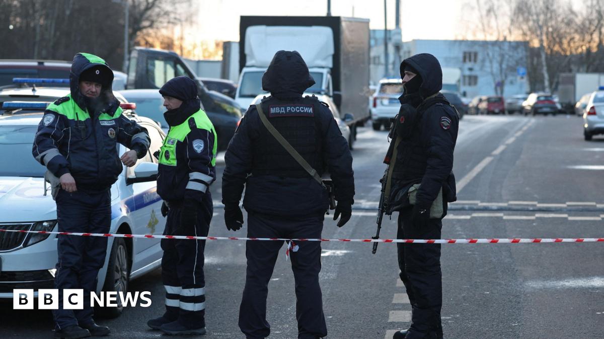 Law enforcement officers block the road near the scene where two traffic police officers and another person were killed in a blast in Moscow, Russia December 24, 2025