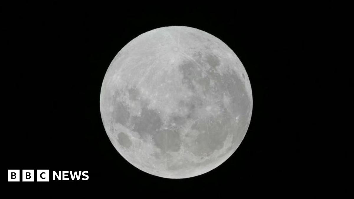 A full moon lighting up a dark night sky