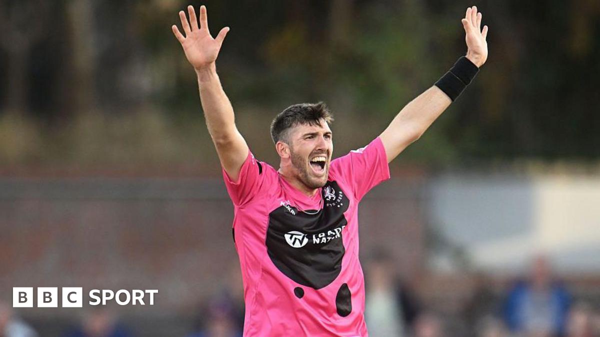 Craig Overton holds his arms aloft