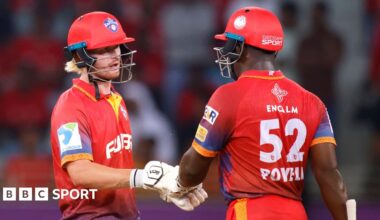 Jordan Cox and Rovman Powell punch gloves