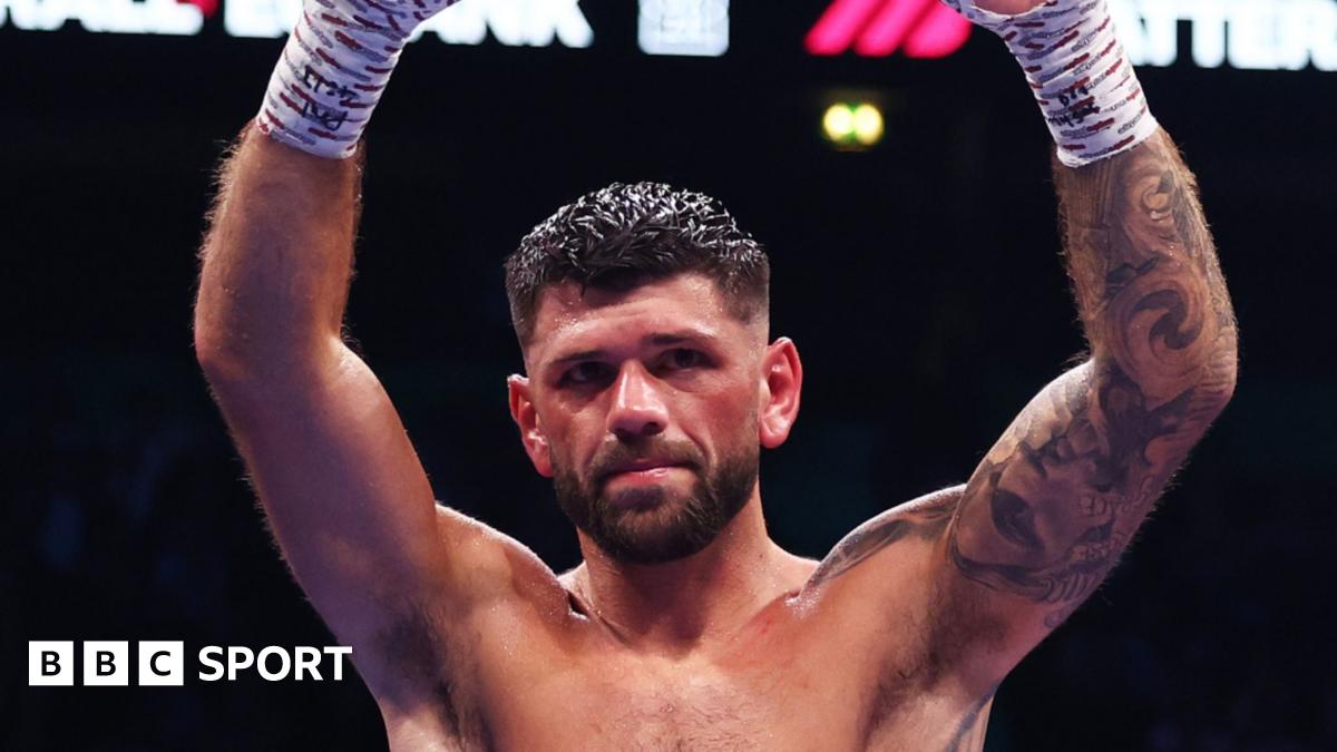 Joe Cordina raises arms aloft in triumph