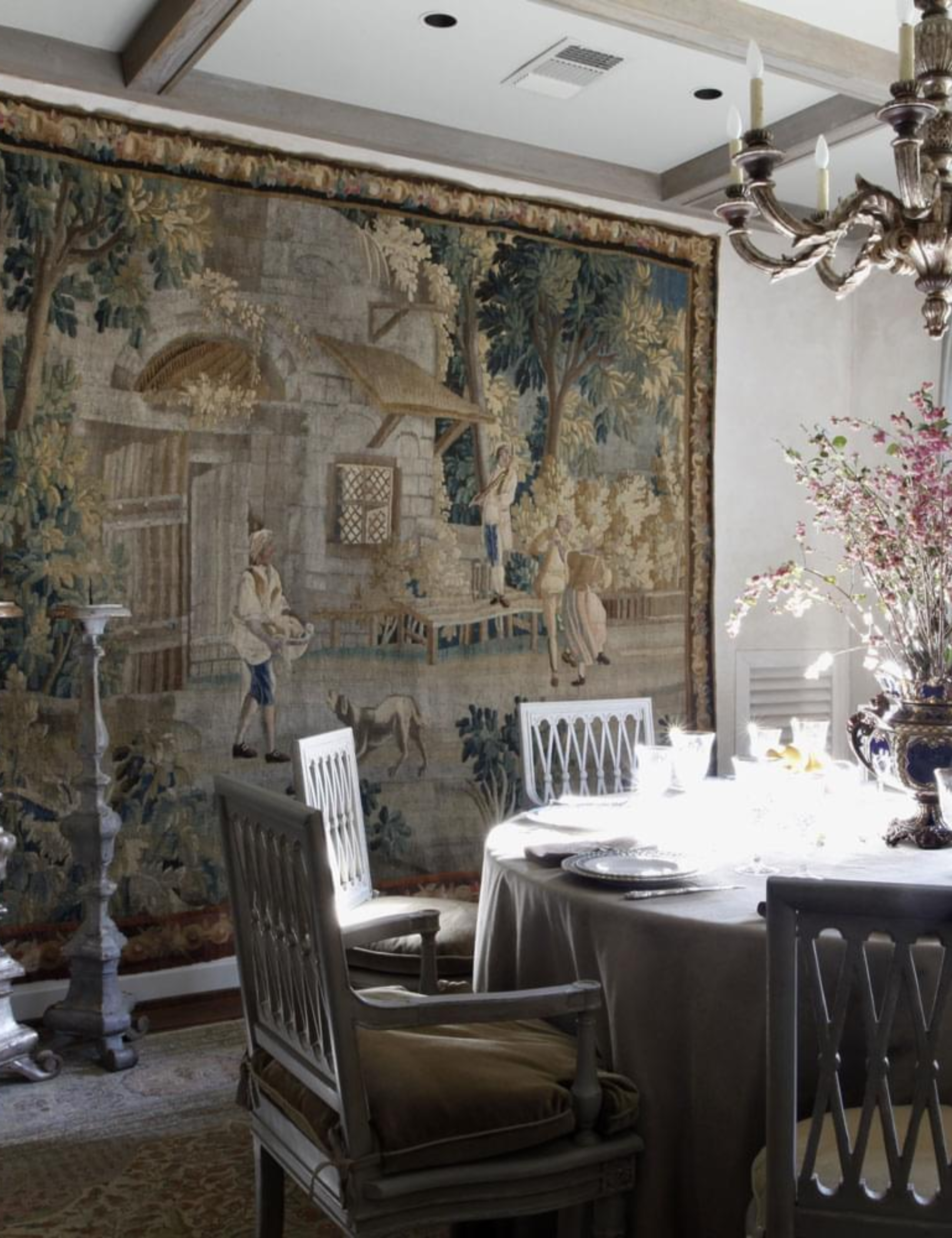 Oversized wall tapestry hanging in an opulent dining room