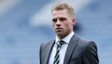 Celtic defender Stephen Welsh walks onto the pitch before the Scottish Cup final wearing a suit