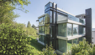 A radical hillside house suspends living space above residential Zurich
