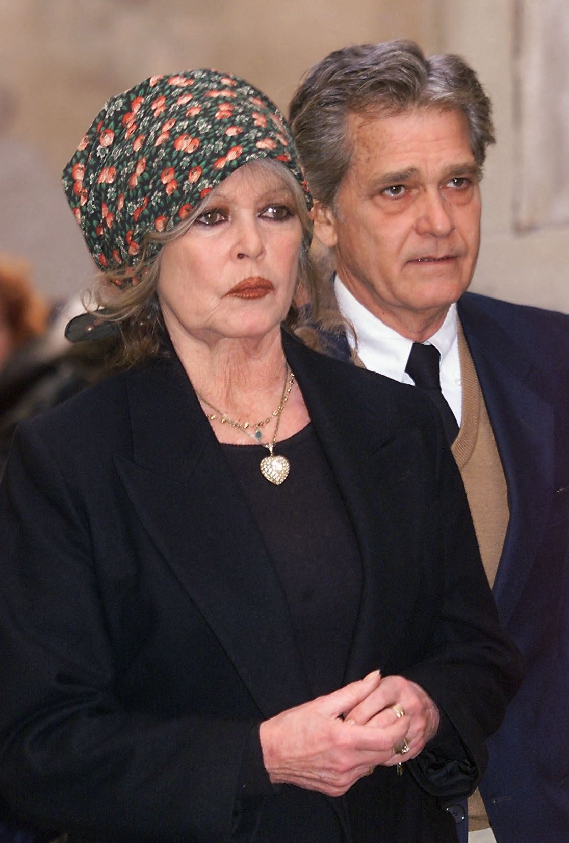Bardot attending the funeral of her first husband, Roger Vadim, in 2000 alongside her fourth husband, Bernard d'Ormale