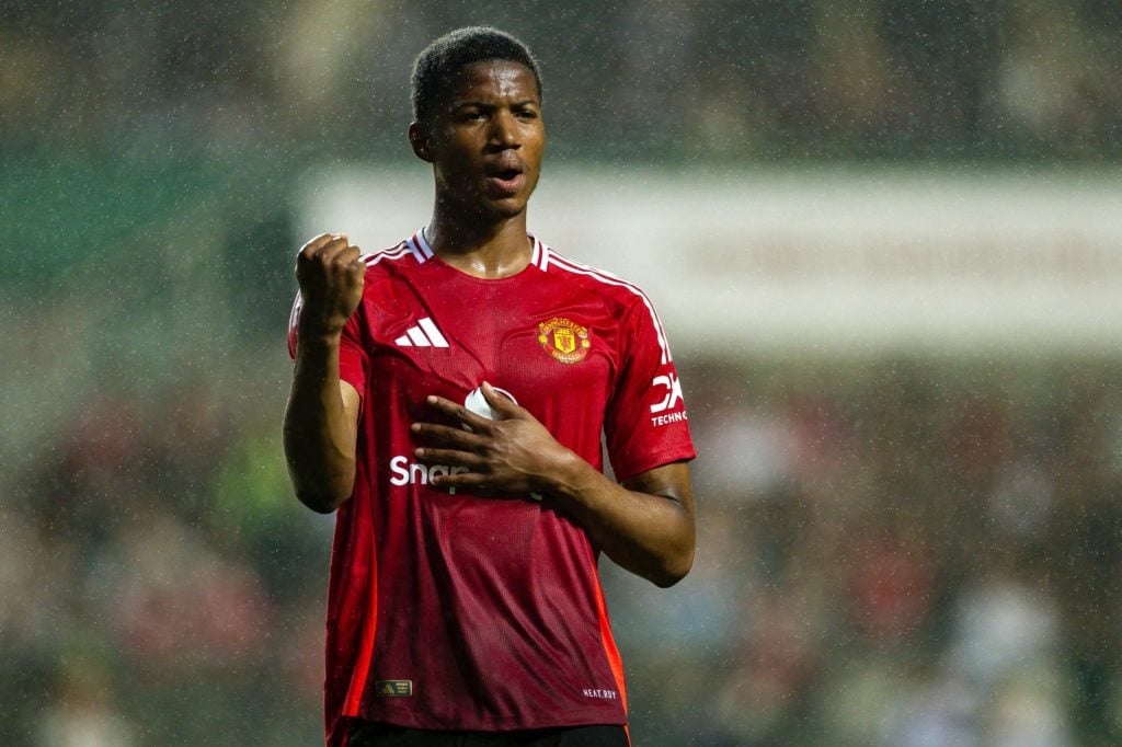 Chido Obi celebrates scoring a brace against Hong Kong.
