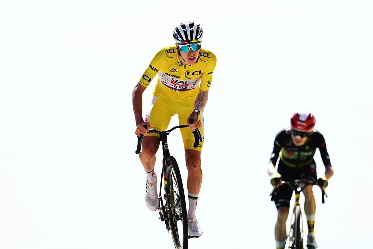 Tadej Pogacar crosses the finish line ahead of Jonas Vingegaard of Denmark and Team Visma | Lease a Bike during the 112th Tour de France 2025, Stage 16.