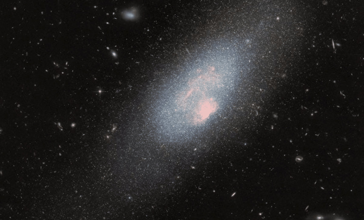 Hubble Telescope Captures Explosive Starbirth In Tiny Galaxy 13 Million Light Years Away