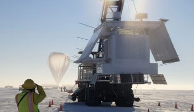 An image from Antarctica shows a giant machine in the foreground with a construction worker with a vest in the front left image and a white weather balloon in the background