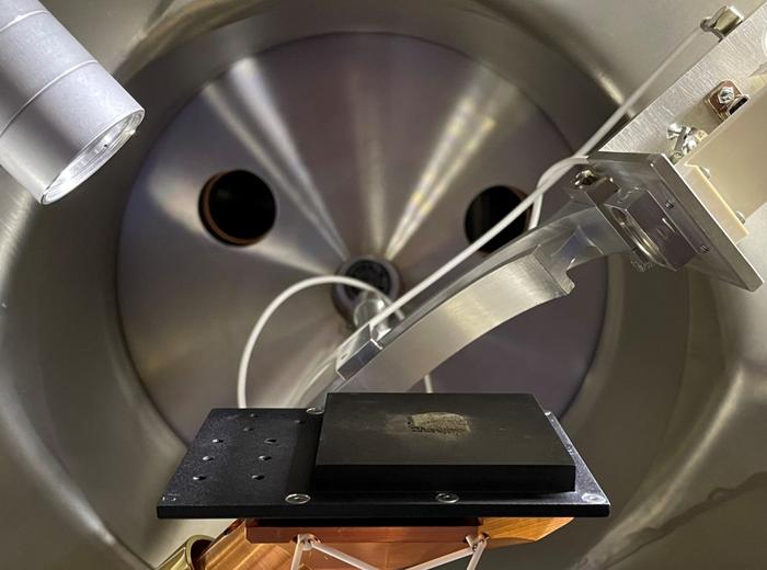 Some of the Apollo sample in a test chamber for a tunneling elecron microscope. Credit - Southwest Research Institute