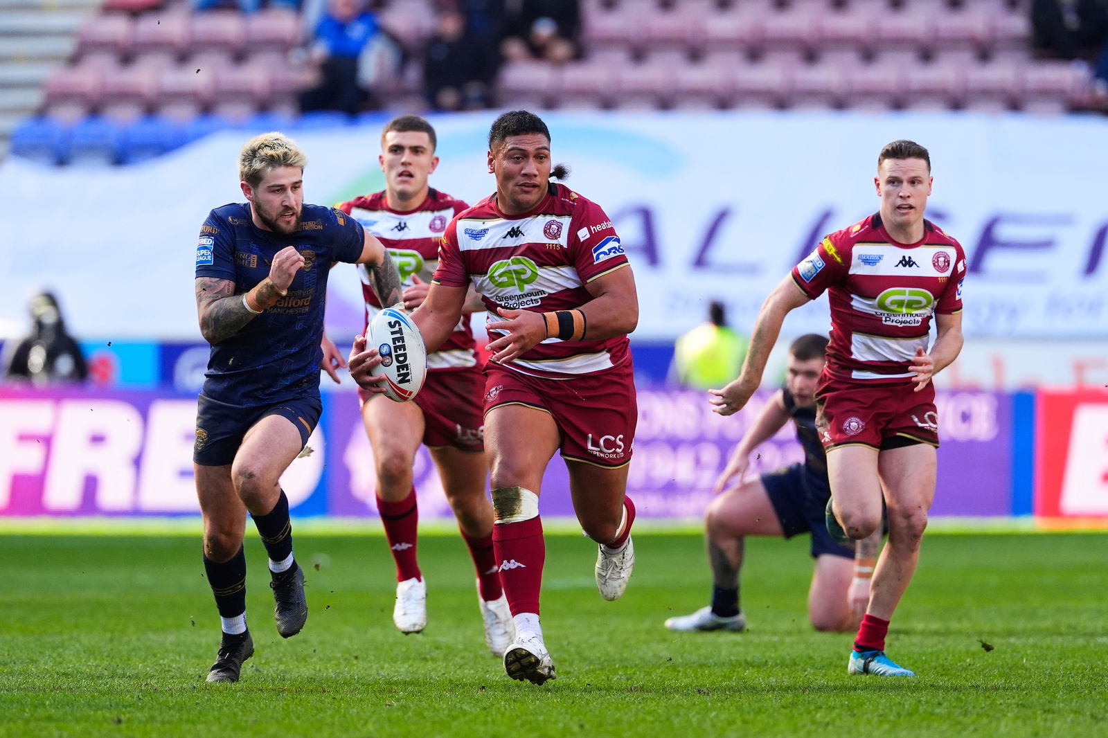 - 30/03/2025 - Rugby League - Betfred Super League - Wigan Warriors v Salford Red Devils - The Brick Community Stadium, Wigan, England - Patrick Mago of Wigan breaks through the Salford defence