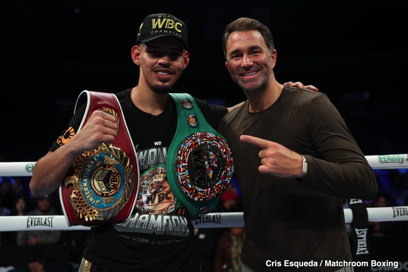 Diego Pacheco poses with promoter Eddie Hearn inside the ring after his unanimous decision win over Kevin Lele Sadjo in Stockton, California.