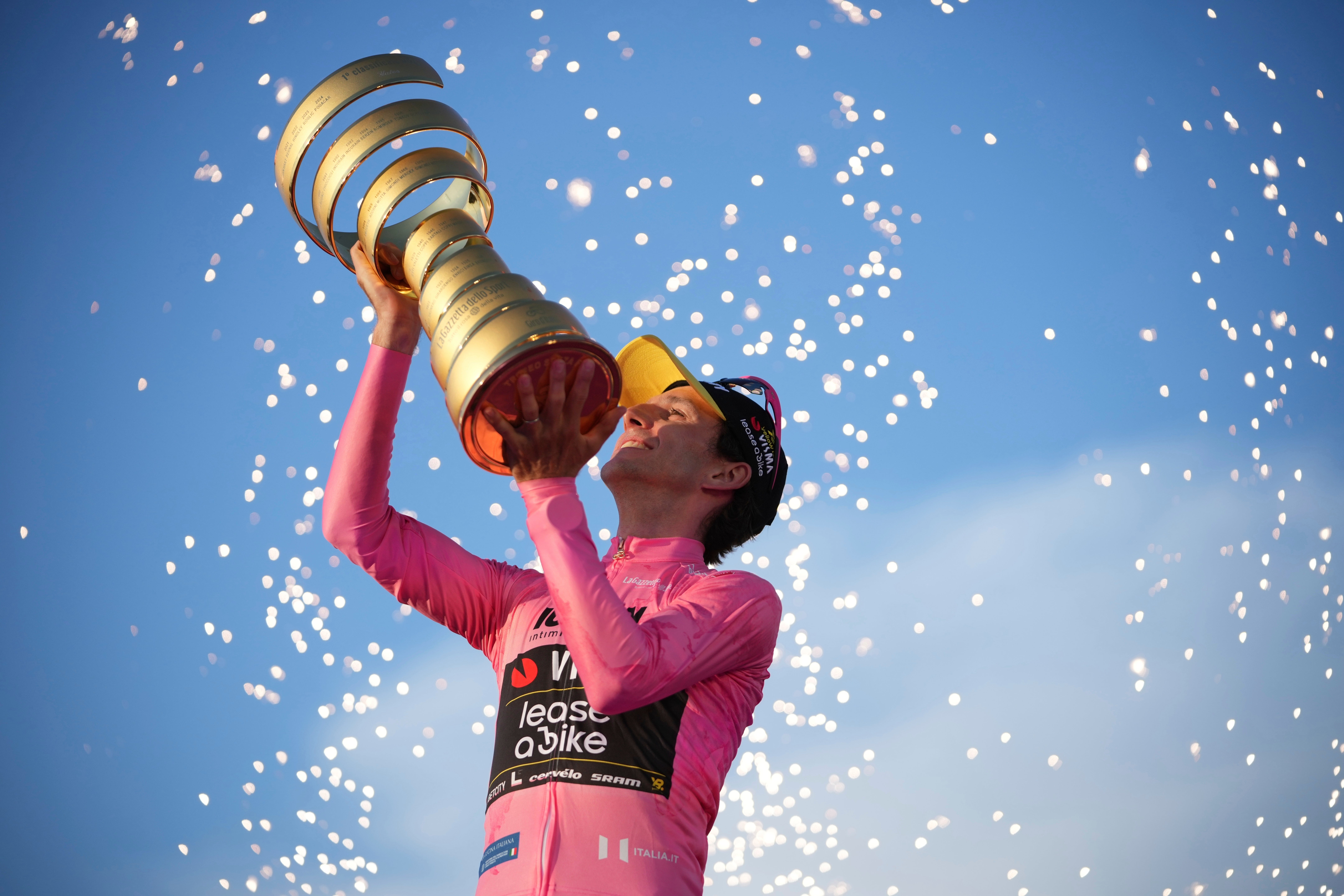Simon Yates lifting one of cycling’s best trophies