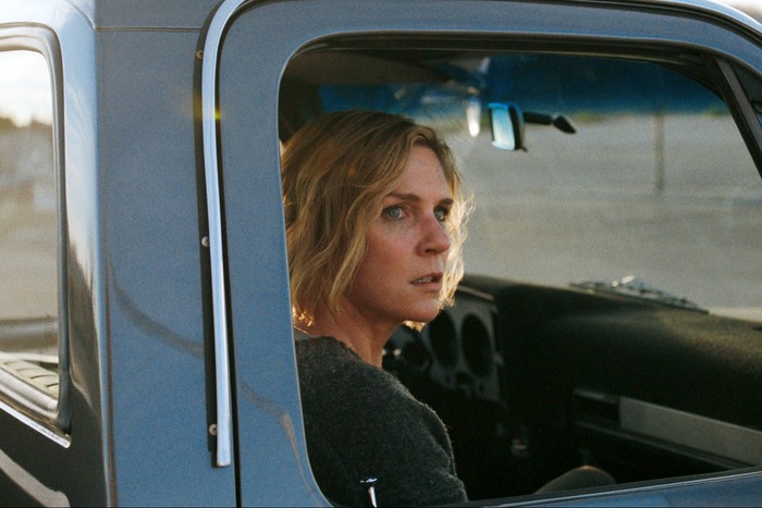 Rhea Seehorn in Pluribus, sat in a car.