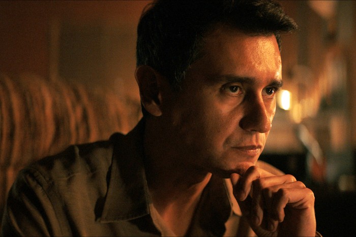 Carlos Manuel Vesga in Pluribus, sat with his hand to his chin.