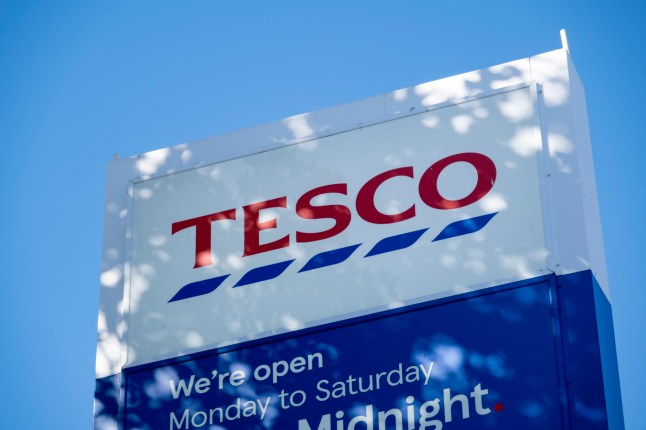 Tesco supermarket logo outise the store on 6th October 2025 in London, United Kingdom. Tesco plc is a global supermarket and general retailer based in the United Kingdom. It is the third-largest retailer in the world by revenue and the second-largest by profits. It is the leading grocery store brand in the UK with a market share of approximately 30%. (photo by Mike Kemp/In Pictures via Getty Images)