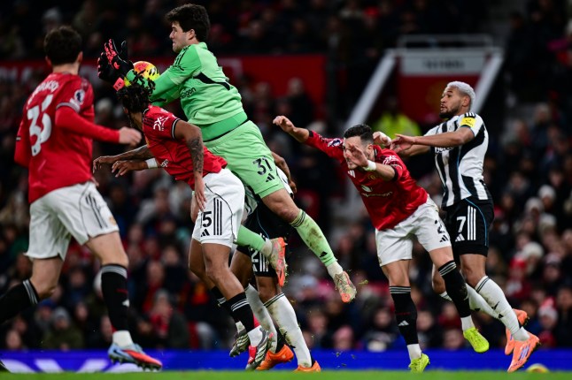 MANCHESTER, ENGLAND - DECEMBER 26: Manchester United Goalkeeper Senne Lammens (31) claims the ball during the Premier League match between Manchester United and Newcastle United at Old Trafford on December 26, 2025 in Manchester, England. (Photo by Serena Taylor/Newcastle United via Getty Images)